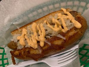 Field Roast Italian Dog! Sauerkraut & Sriracha mayo atop  at Dat Dog in New Orleans