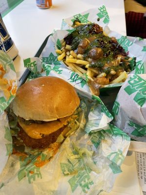 Spicy chicken burger and Christmas poutine to share.  at Oowee Vegan - Baldwin in Bristol