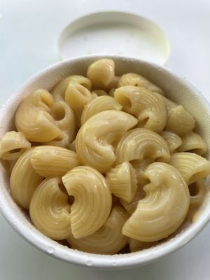 Mac and cheese with no bac’n or onion rings  at Oowee Vegan - Baldwin in Bristol