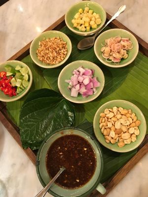 Miang Kam - a classic Northern Thai sharing appetiser where you place all these little ingredients on a Betel leaf, usually comes with shrimp at Ginger Farm Kitchen in Chiang Mai