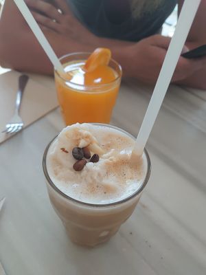 Iced caramel latte and orange juice  at Brunch and Cake By The Sea in Barcelona