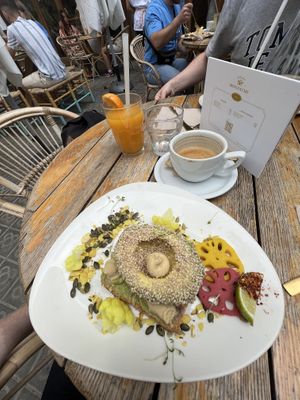 Vegan avocado toast, orange juice and oat latte  at Brunch and Cake By The Sea in Barcelona