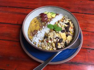 Breakfast Bowl with granola, nuts and seeds based on coconut banana smoothie at Ganita Cafe in Pai