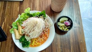 Khao Soi (Ganita style) with mock meat, tofu, greens and jackfruit seeds at Ganita Cafe in Pai