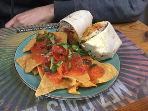 Vegan burrito with chips and salsa at Mez Factory in Lisbon