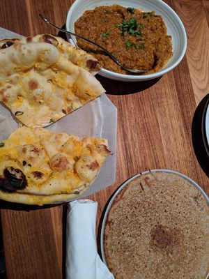 Vegan eggplant curry, garlic naan, and buckwheat roti at Dancing Yak in San Francisco