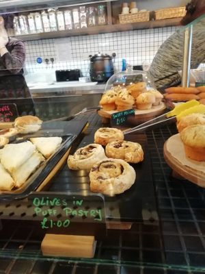 Vegan items are written in green pen at Brick and Olive in North London