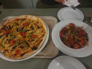 Pizza Verde with vegan cheese and salad siciliana at Laganon in Crete
