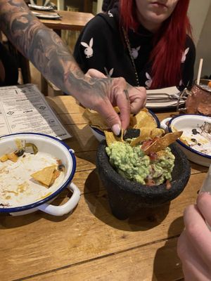 The guac and the empty nacho plates  at Gallo Santo in Barcelona