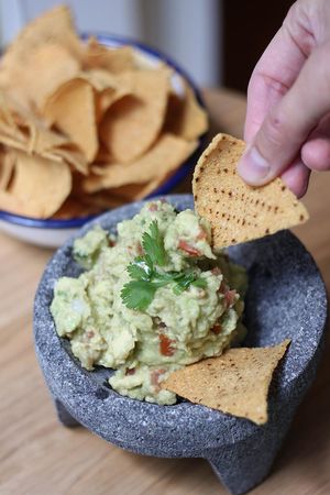 Irresistible Guacamole with corn tortilla chips. at Gallo Santo in Barcelona