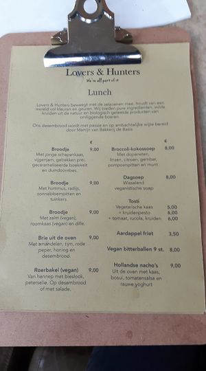 Menu includes hummus sandwich, vegan scramble, vegan grilled cheese and vegan bitterballen. at Lovers & Hunters in Broek Op Langedijk