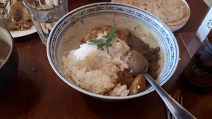 Half eaten Mushroom and Pea curry bowl at Tama in Auckland