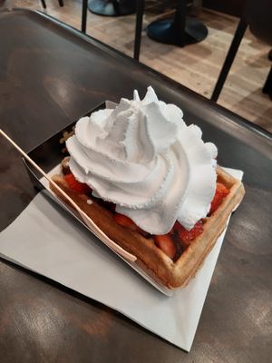 Belgian waffle with strawberries, chocolate and whipped cream at VeganWaf in Brussels