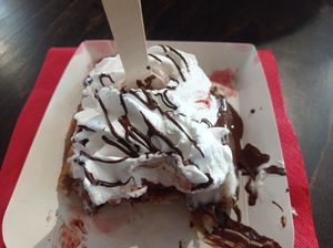 Vegan waffle with strawberries, chocolate sauce and whipped cream. at VeganWaf in Brussels