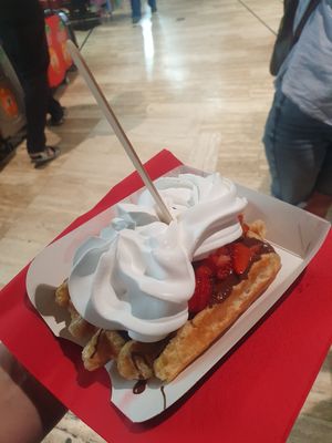 Waffle with chocolate sauce, strawberries and whipped cream at VeganWaf in Brussels