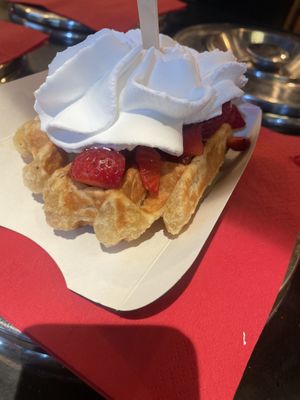 With strawberry and whipped cream   at VeganWaf in Brussels