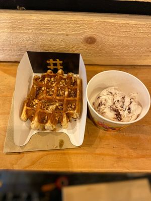 Amazing vegan waffle with maple syrup and crispy hazelnuts and a scoop of ferrero rocher icecream!! So worth it! at VeganWaf in Brussels