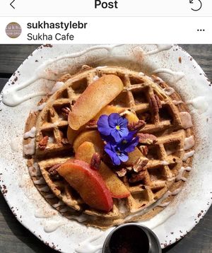 Housemade waffle topped with fresh local fruit at Sukha Cafe in Baton Rouge