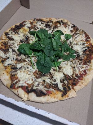 Mushroom pizza at Loving Hut in Northbridge