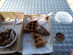 Chicken and waffles with side of home fries. at Vegans Are Us in Vineland