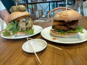 Fysh burger and chicken burger with bacon and hash brown at GG Bistro in Christchurch