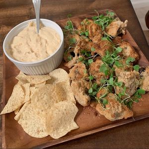Breaded airfried mushroom with a cheesy dip sauce. Try the buffalo wild wings with blue cheez as well. Delicious! at My Conscious Plate in Lake Worth