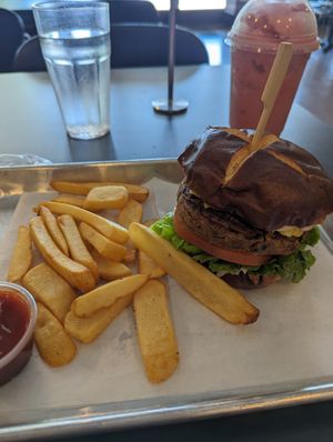 Caribbean jerk burger with fries at Vegan Plate in Roseville