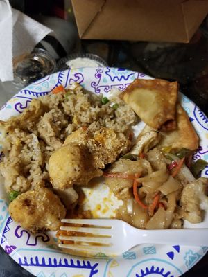 Don't mind my ugly half eaten plate but this is fried rice, buffalo bites before adding sauce, drunken noodles and artichoke won tons. at Vegan Plate in Roseville