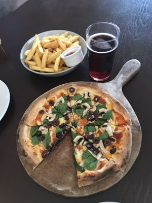 Fries, vegan pizza and berry cider  at Sprig & Fern in Christchurch