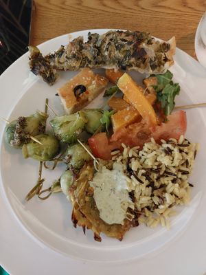 First plate 😎 Brussel sprouts in sauce, olive ciabatta, spinach pie, tomatoes with salt, butternut squash roasted, mixed rice and tatar sauce. at DaTerra - Rua da Rosa in Lisbon