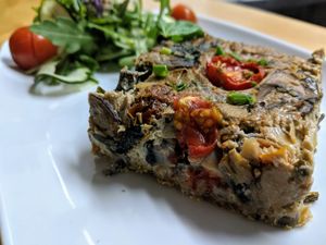 Tofu Quiche with Veggies, Mushrooms, Spinach and Sun-dried Tomatoes on Almond & Oat Crust  at La Sociedad Herbivora in Malaga