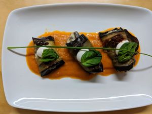 Aubergine Rolls stuffed with Cashew Ricotta and Portobello served on Homemade Tomato Sauce at La Sociedad Herbivora in Malaga