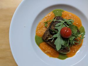 Aubergine Parmigiana with Rúcula Pesto, Courgette and Tomato Sauce at La Sociedad Herbivora in Malaga