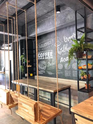 Loft style interior and swing seats at Fruit Fusion in Phuket