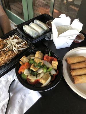 Spicy basil stir fry, pad Thai (no egg + added mock chicken), fried and fresh spring rolls.  at Taste of Thai Express in Ithaca
