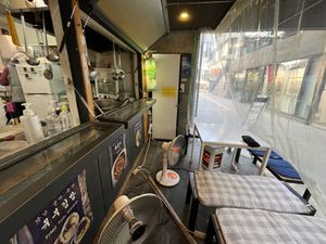 Seating area (kind out in the street and that morning was -9 degrees) 🥹   at Maru JaYeonSik Kimbap in Seoul