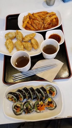 Ddukbokki, fried dumplings, and kimbap. We were also given some savory broth to enjoy! at Maru JaYeonSik Kimbap in Seoul