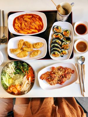 Our Spread!!! (Clockwise from red spicy rice cakes) - Tteokbokki, Kimbap, Kong Chicken, Bibim Naengmyeon, Mandu (dumplings). at Maru JaYeonSik Kimbap in Seoul