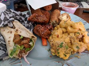 Buffalo chicken wrap, hunni garlic wings, mac and cheese, and mozza sticks at Real Fake Meats in Halifax