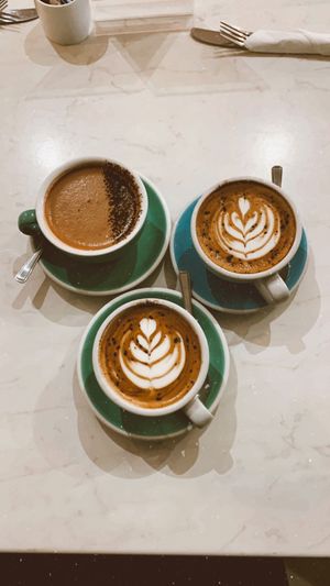 Two cappuccinos & an orange hot chocolate  at The Flower Cup in Chester