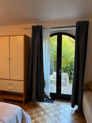 bedroom with outdoor seating access at La Beuratte in Cornimont