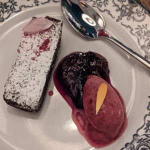 Dessert course: chocolate cake with plum roulade and plum sorbet.  at Brasserie Uno in Zermatt