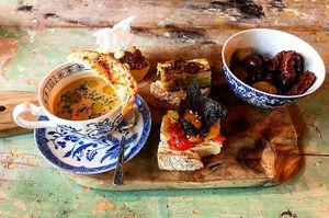 Vegetarian snack plate with vegan gazpacho, beetroot tartar, tortilla, olives and roasted peppers at Brasserie Uno Zermatt. at Brasserie Uno in Zermatt