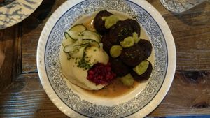 Amazing vegan balls with mash and loganberry and picked cucumber at Brasserie Uno in Zermatt