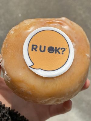 Vegan vanilla glazed donut for R U OK day. Super fluffy and delicious! Left the logo since I wasn’t sure if that was vegan.   at Doughheads in Newcastle