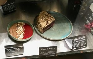 Vegan chocolate cake in the display case at Poslasticarnica Suma in Belgrade
