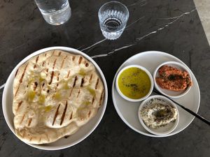 Bread and spread with babaganoush, muhammara, and double olive oil at Comune in Columbus