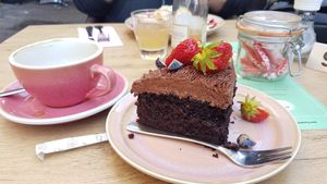 Vegan chocolate cake and oatmilk cappuccino at Coffeelicious Bakery in Dordrecht