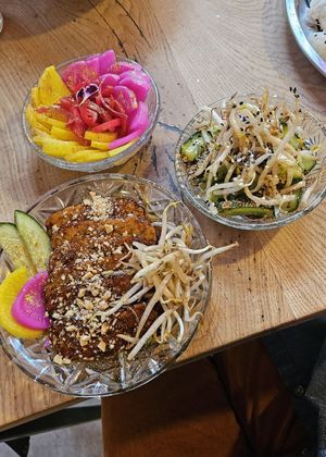 Tempeh glaze, Japanese pickles, and cucumber salad. at House of Seitan in Gdansk