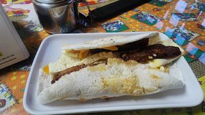 tapioca wrap stuffed with fried egg, plantain, cheese, potatoes?, carrots? very good. yum. favorite dish. at Casa da Pamonha in Manaus